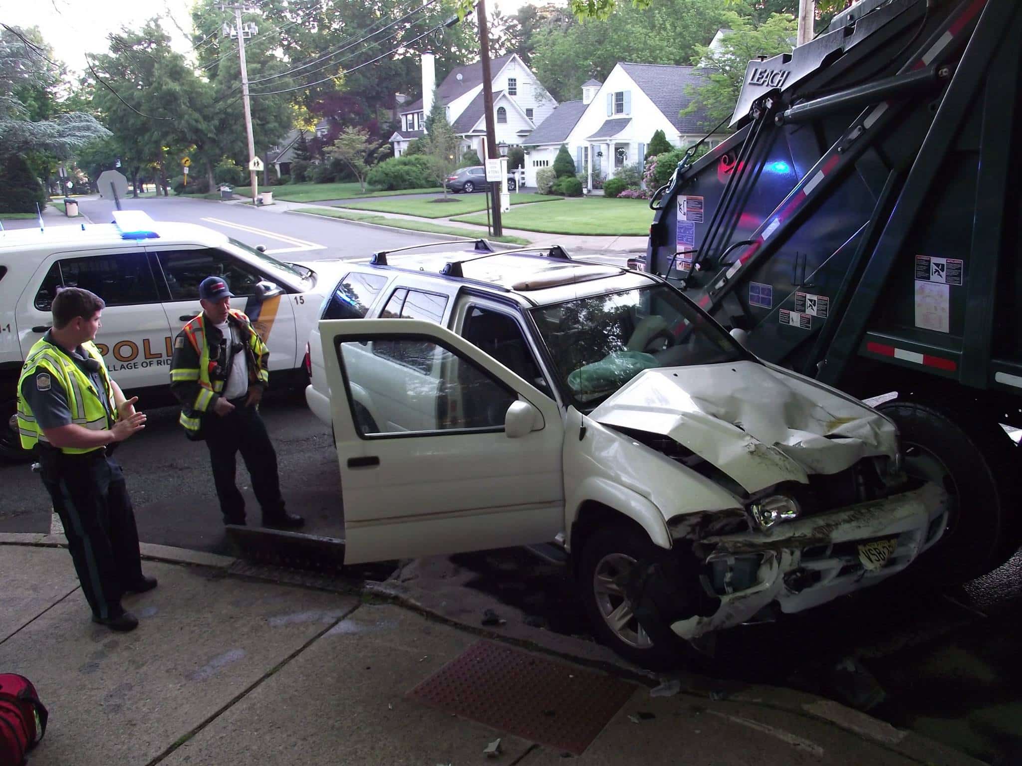 Nissan Pathfinder collided with a Village of Ridgewood owned sanitation truck
