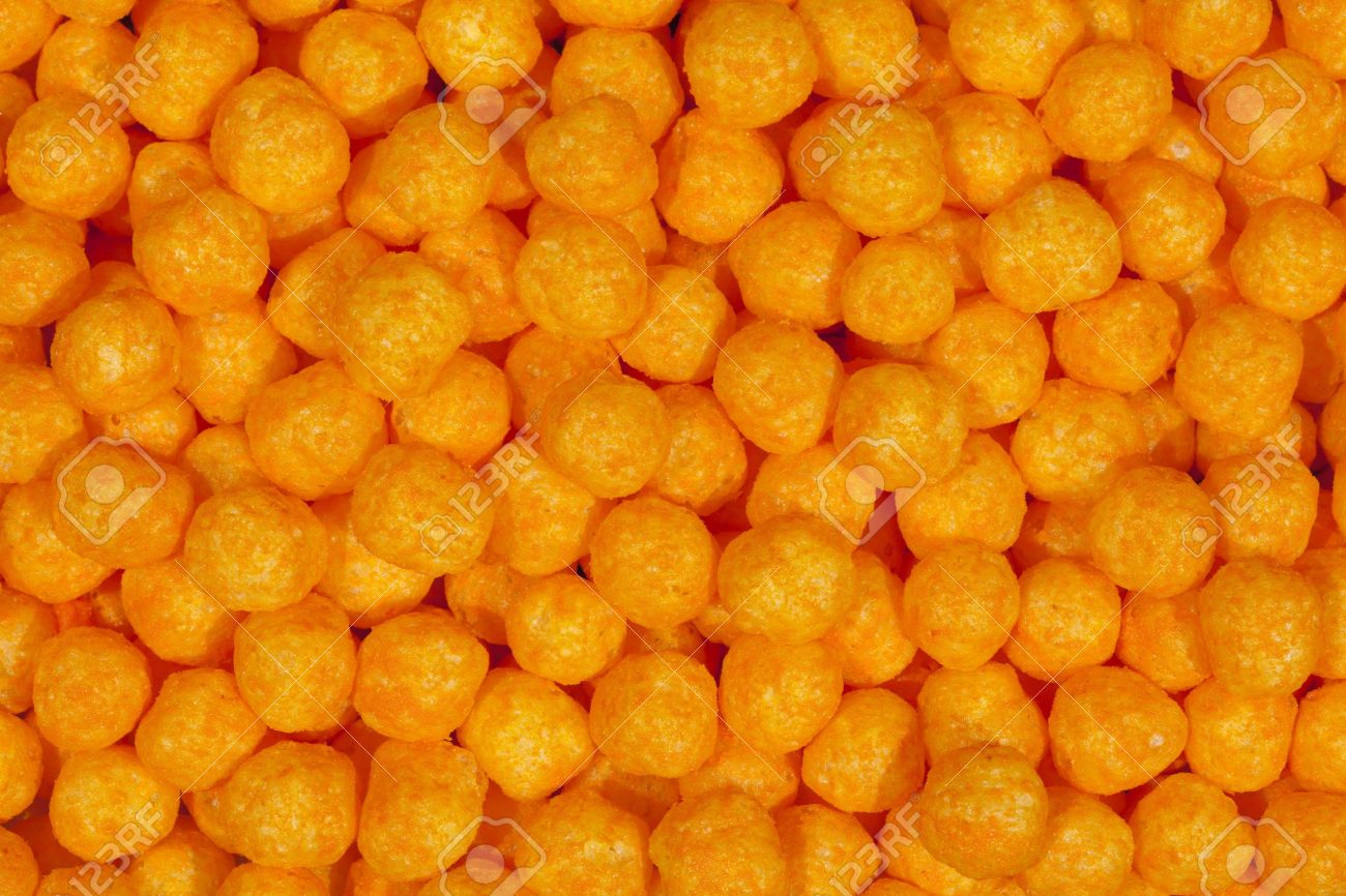 9448792 puffy cheese balls snack background