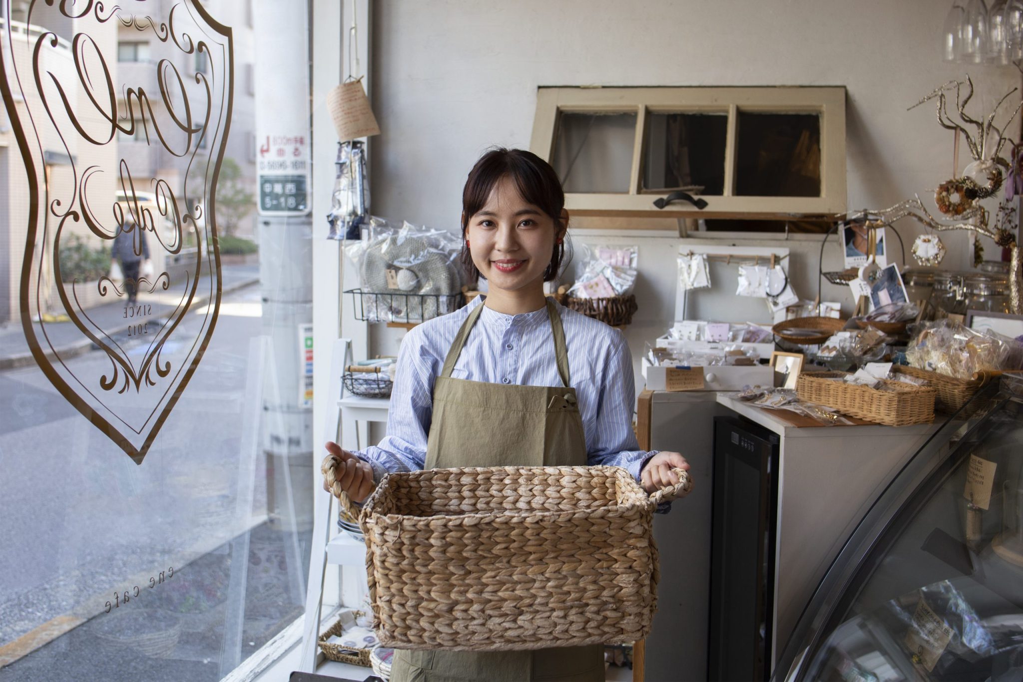 young woman arranging her cake shop scaled 1 scaled
