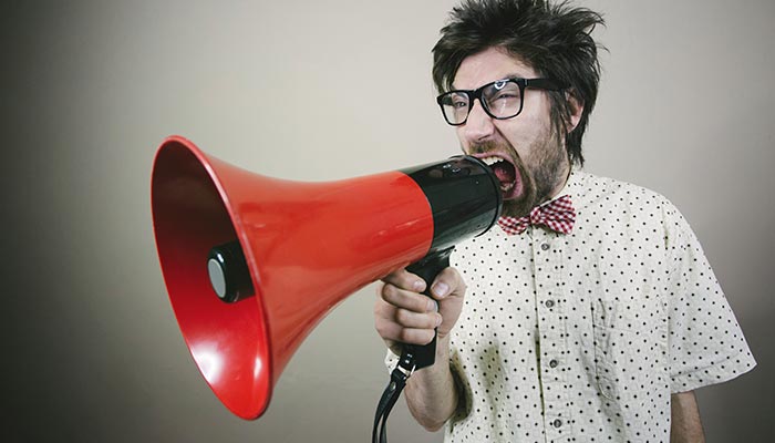 yelling nerdy guy megaphone 730869364